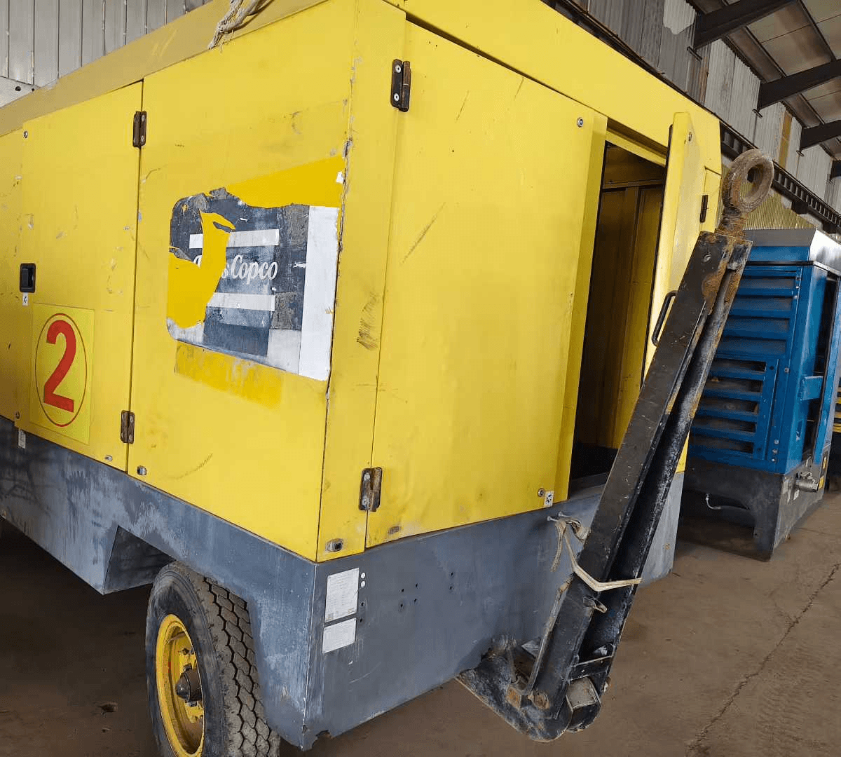 Atlas Copco XRHS 888 other side of the portable air compressor body and compartment door