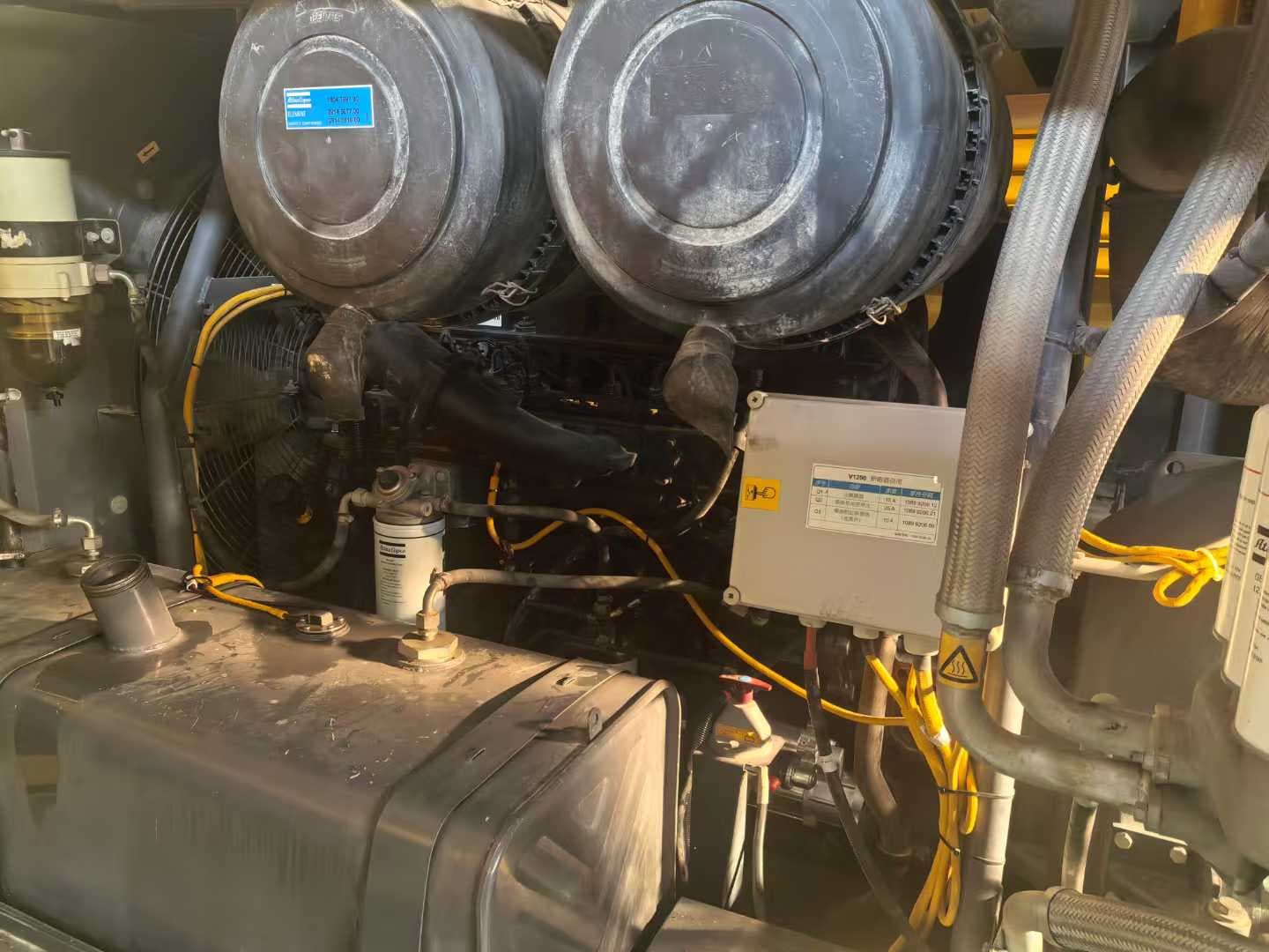 Engine bay and air intake components inside the portable compressor enclosure