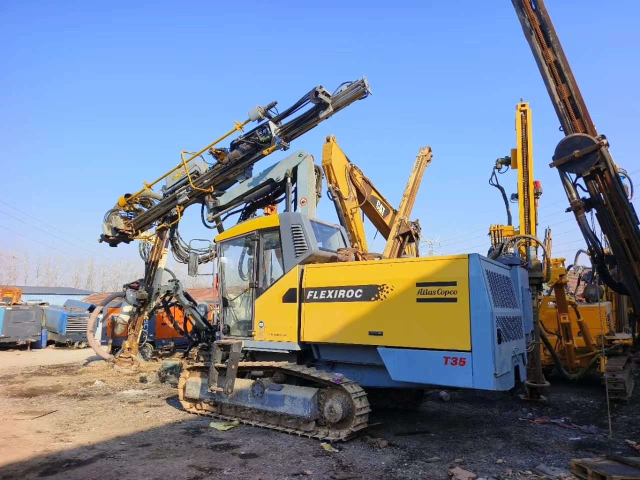 Used Atlas Copco T35 top-hammer surface drill rig parked outdoors