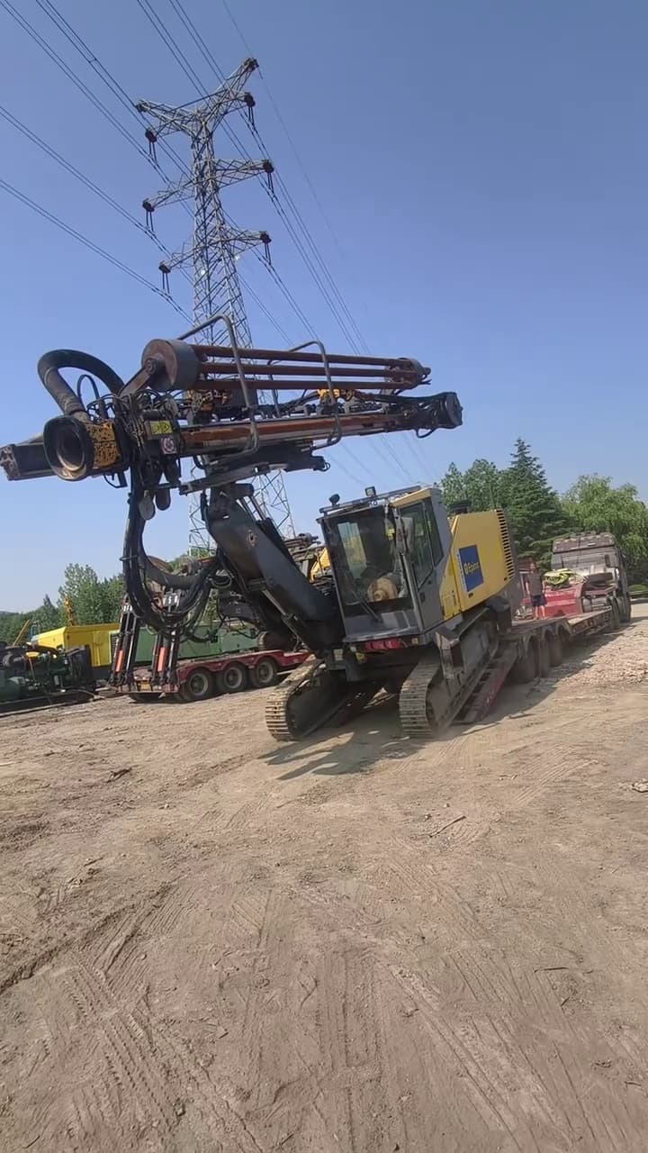 Used Atlas Copco D55 down-the-hole surface drill rig in a quarry yard