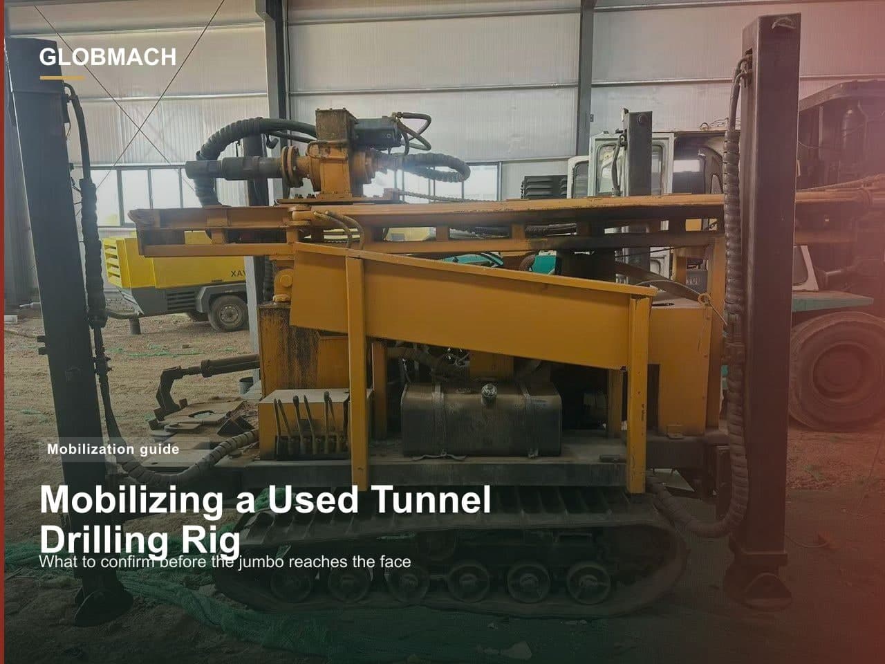 Used single-boom tunnel drilling jumbo parked in an equipment yard