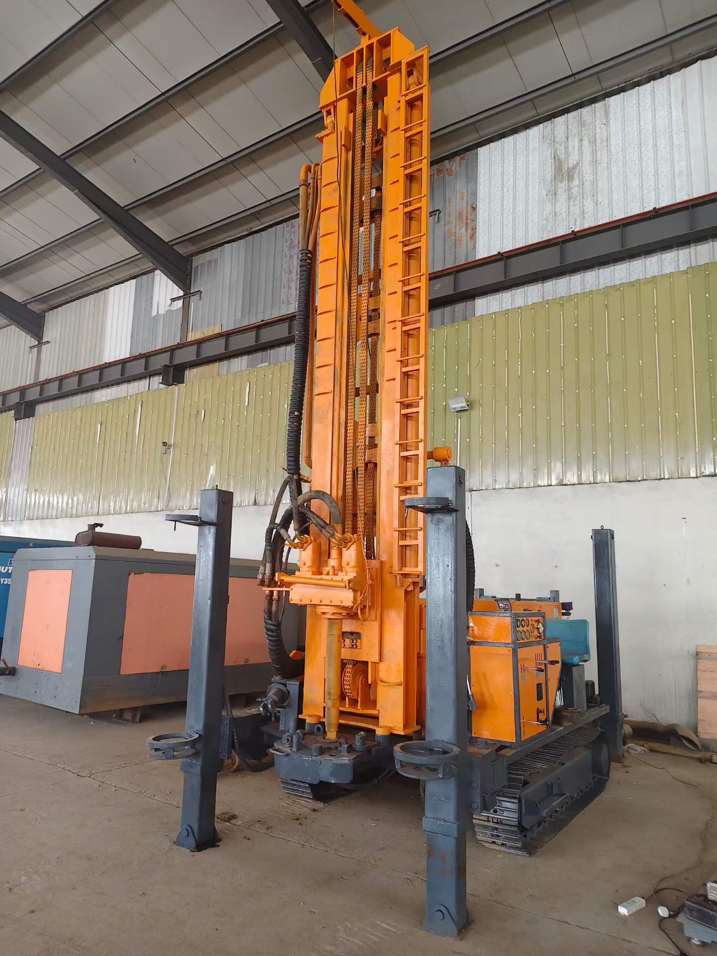 Front view of the used Jinrui 350 crawler drilling rig with mast raised